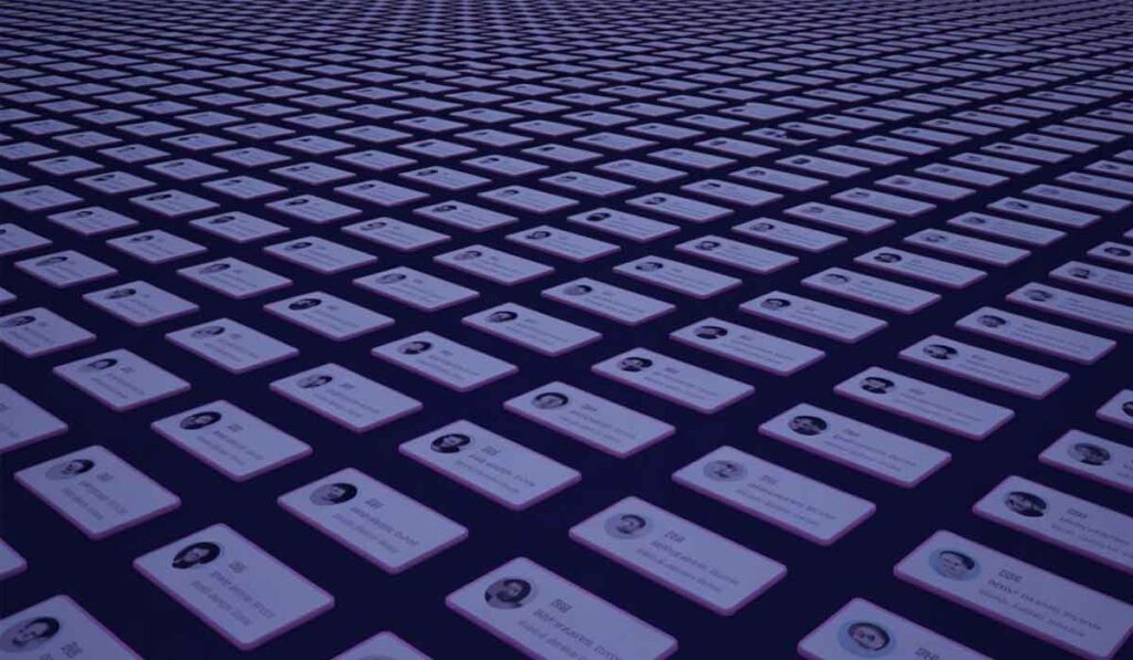 Rows of identification cards with profile photos are arranged in a grid pattern, extending into the distance on a dark surface.